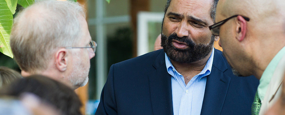 Endowments President Grant Oliphant speaking to Board Member Franco Harris at Phipps Conservatory.