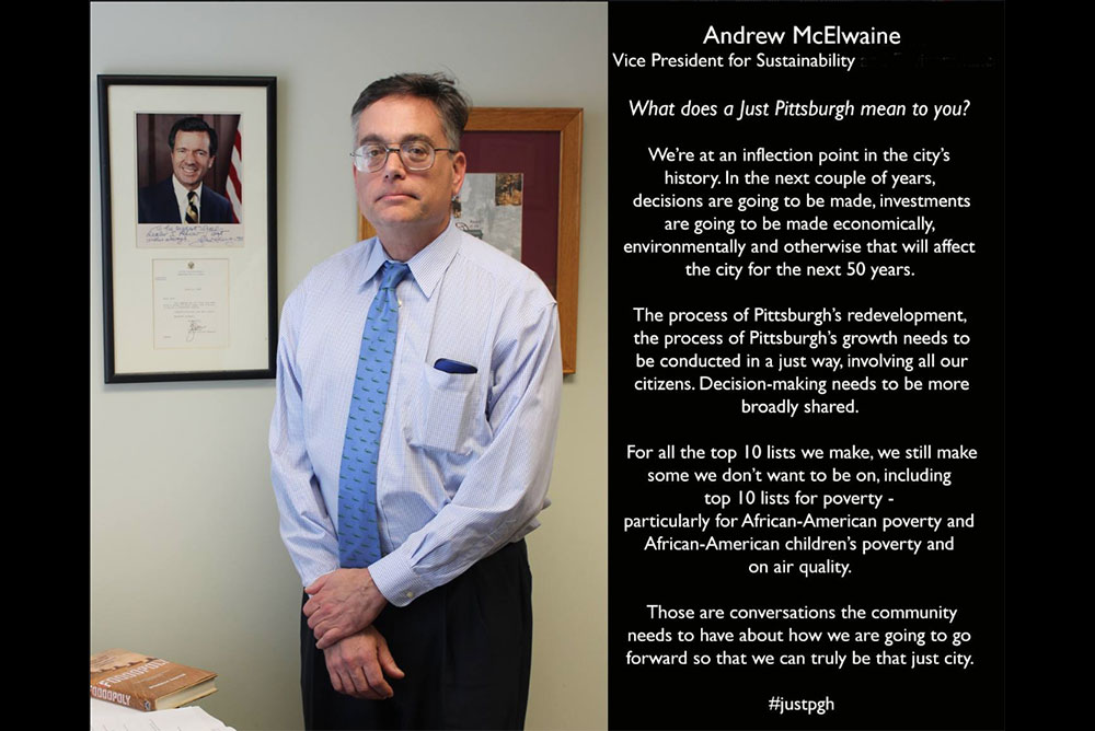 Image of Andrew McElwaine standing in his office in front of an image of the late Sen. John Heinz