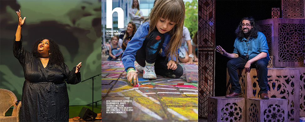 Little girl looking down at the chalk drawing she's working on.