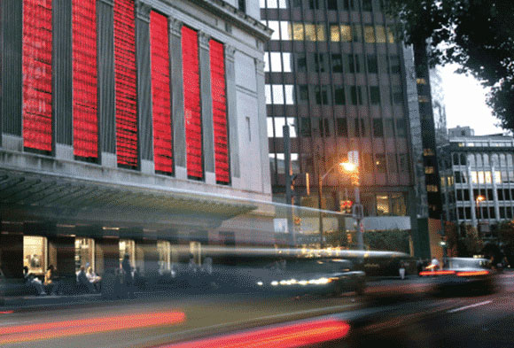 Street view of the Wood Street Galleries with cars going by at the corner of Wood Street and Sixth Avenue in Downtown Pittsburgh.